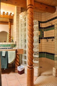 The Royale Bath at Touchstone Inn features a double shower glass block enclosure.